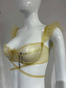 Latex bra with underwire, bow detail, and ruffled straps.